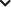Blurred black downward-pointing chevron.